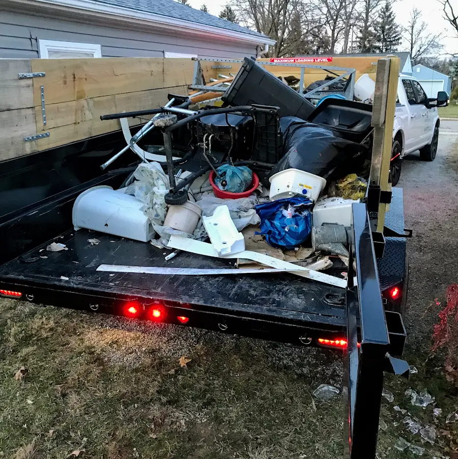 Roll-off dumpster delivered to a residential driveway in Warsaw